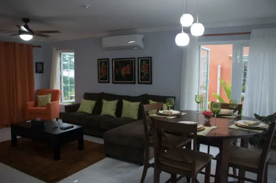 Living area with seating and doors to the terrace